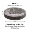 Picture of Furhaven Pet Dog Bed - Round Plush Faux Fur Waves and Velvet Ultra Calming Anti-Anxiety Hooded Tufted Pillow Cushion Donut Bolster Pet Bed for Dogs and Cats, Dark Gray, Small