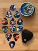 Picture of Space Guitar Picks 12 Pack W/Tin Box & Picks Holder. Celluloid Medium Cool Picks an Awesome Gift for Men & Women Guitarists For Acoustic Electric and Bass Guitars