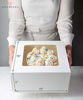 Picture of COCOPODS 25 Pack Auto Pop-Up Cake Boxes with Viewing Window & 50 Stickers - This White 10x10x5 Bakery Boxes Container is Suitable For Cakes, Cupcakes, And Cookies - Dessert Boxes with Clear Display