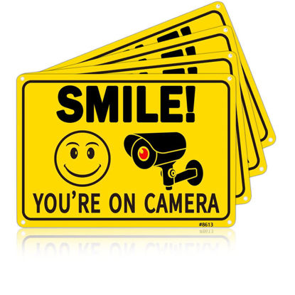 Picture of 4Pcs Smile You're On Camera Signs - Aluminum, UV Ink Printed, Outdoor Video Surveillance & Security Camera Signs for Property - Orange with Black Font, 7x10 Inches, 4 Pre-Drilled Holes - Ideal Home Security Signs for Yard, Business, Driveway Alert, 