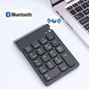 Picture of Bluetooth Numberic Pad,USB Wireless Number keypad, 18 Keys Slim Portable Mini Financial Accounting Numeric Keypad, Multi-Function Numeric Pad Extensions for Laptop Desktop, PC, Surface Pro,Notebook