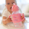 Picture of Dr. Brown's Milestones Wide-Neck Sippy Straw Bottle with 100% Silicone Handles and Weighted Straw, 9 oz/270 mL, Pink, 6m+