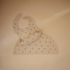 Picture of mushie Silicone Baby Bib | Adjustable Fit Waterproof Bibs (Black Daisy)