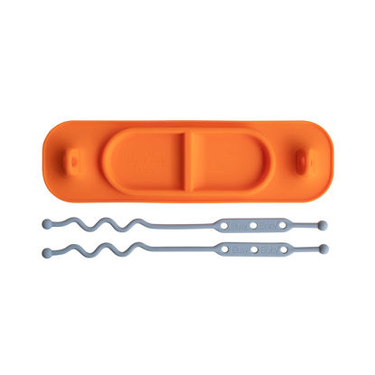 Picture of BUSY BABY MAT | Silicone Mini Suction Placemat for Babies & Toddlers with Adjustable Tethers to Attach Toys | Keep Toys Off The Floor, Dishwasher Safe, BPA Free | Includes Travel Sleeve (Orange)