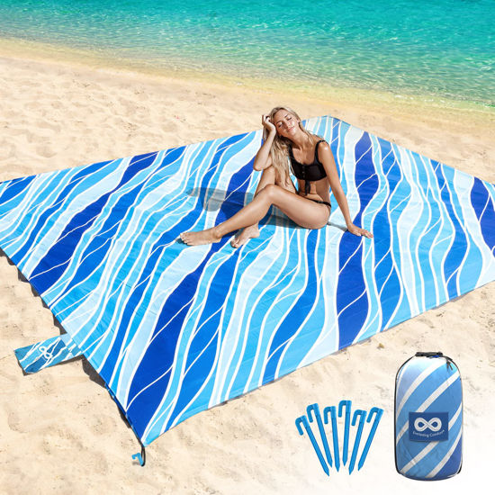 Picture of Everlasting Comfort Beach Blanket Waterproof Sandproof - Large Oversized Sand Free Beach Mat Fits Up to 10 People w/Stakes, Storage Bag - Essentials for Beach, Picnic, Concert