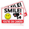 Picture of 2 Pack Smile You're On Camera Signs,Aluminum, UV Ink Printed, Outdoor Video Surveillance & Security Camera Signs for Property,Orange with Black Font, 7x10 Inches, Driveway Alert, CCTV