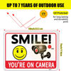 Picture of 2 Pack Smile You're On Camera Signs,Aluminum, UV Ink Printed, Outdoor Video Surveillance & Security Camera Signs for Property,Orange with Black Font, 7x10 Inches, Driveway Alert, CCTV